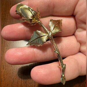Rose brooch, EUC, gold toned. 3” long x 1 1/2” wide at leaves.